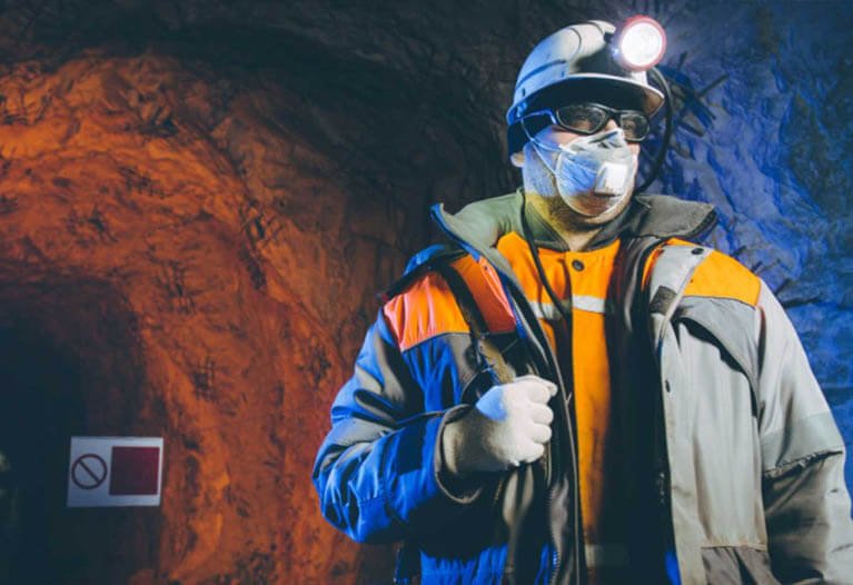 Diverse mining workforce wearing various types of hi-vis clothing across different mining environments