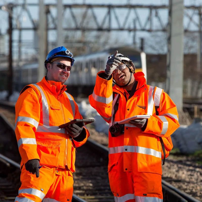 Railway workers in hi-vis clothing during track maintenance operations