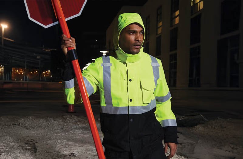 Highway workers in Class 3 hi-vis clothing working near high-speed traffic
