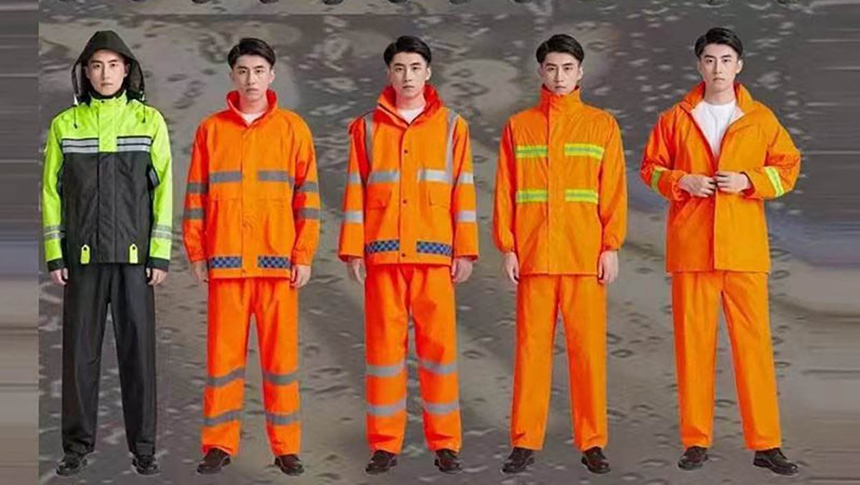 Professional worker wearing complete hi-vis rain suit in challenging weather conditions, demonstrating full-body waterproof protection with reflective safety tape