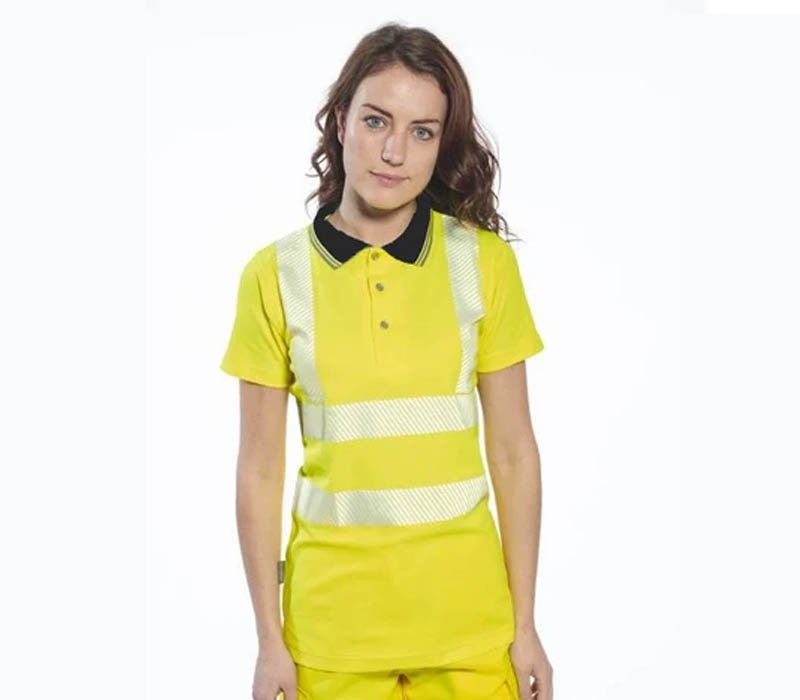 A woman wearing a tailored and professional womens hi vis polo shirt.